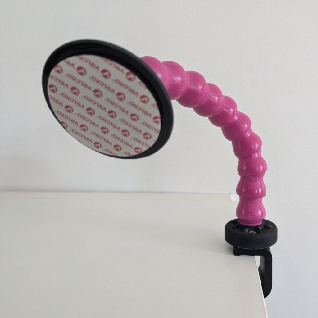 Support articulé Flexzi rose avec scratch fourni pour fixer directement un contacteur, idéal pour une utilisation adaptée