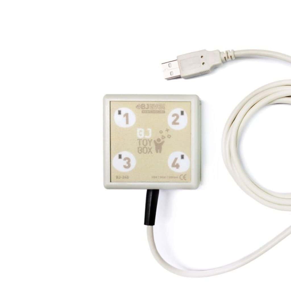 Communication alternative handicap moteur et contrôle d'environnement avec le BJ ToyBox 2 BJ ToyBox Interface avec quatre boutons numérotés et câble USB, conçue pour faciliter l'interaction avec des jouets et appareils adaptés.
